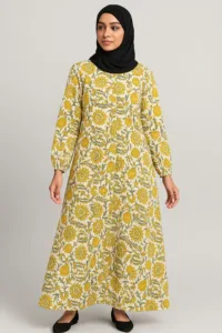 Girls abaya with mustard-yellow floral print on cream, worn with a black hijab
